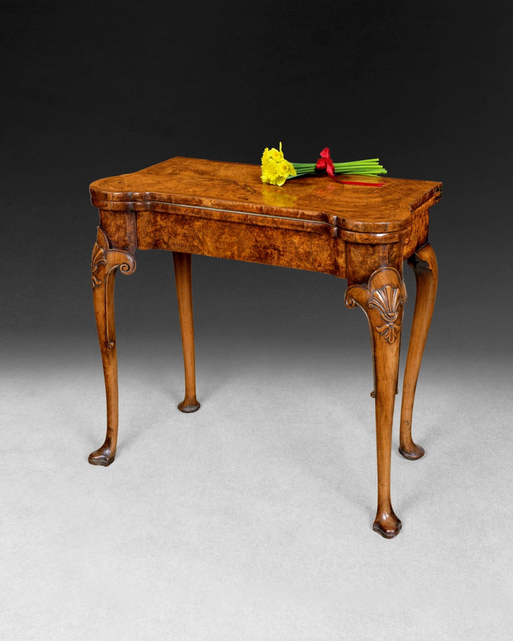 George II Burr Walnut and feather banded card table 