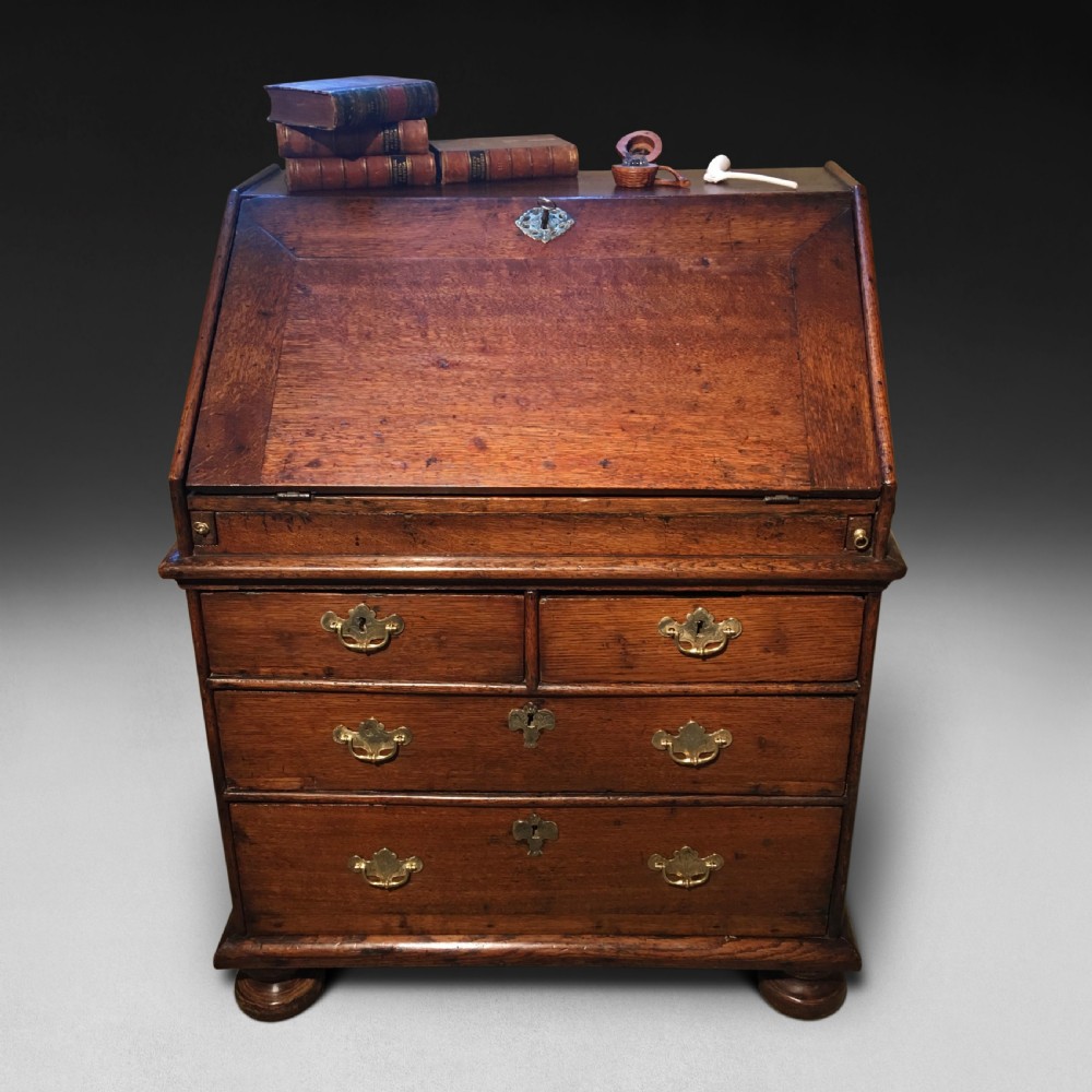 A charming and small Queen Anne Period Oak Bureau View II