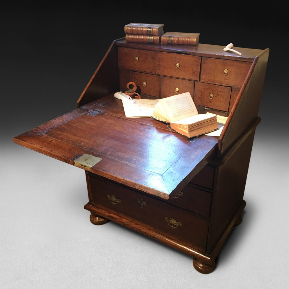 A charming and small Queen Anne Period Oak Bureau View III