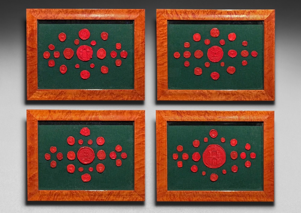 Decorative collection of 19th century Red Seals mounted in 4 frames, 84 in total