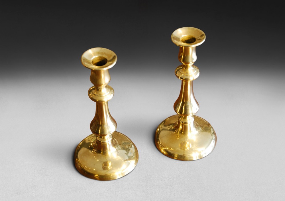 Pair of Mid 19th. Century Brass Candlesticks with circular bases