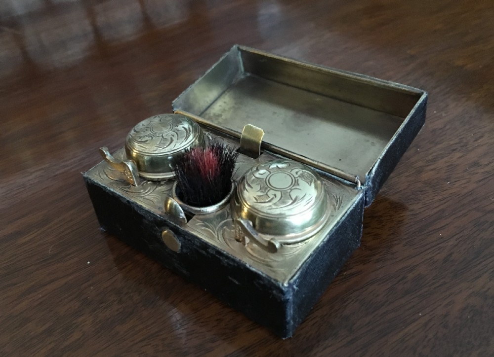 Rectangular black leather clad travelling inkwell with double wells