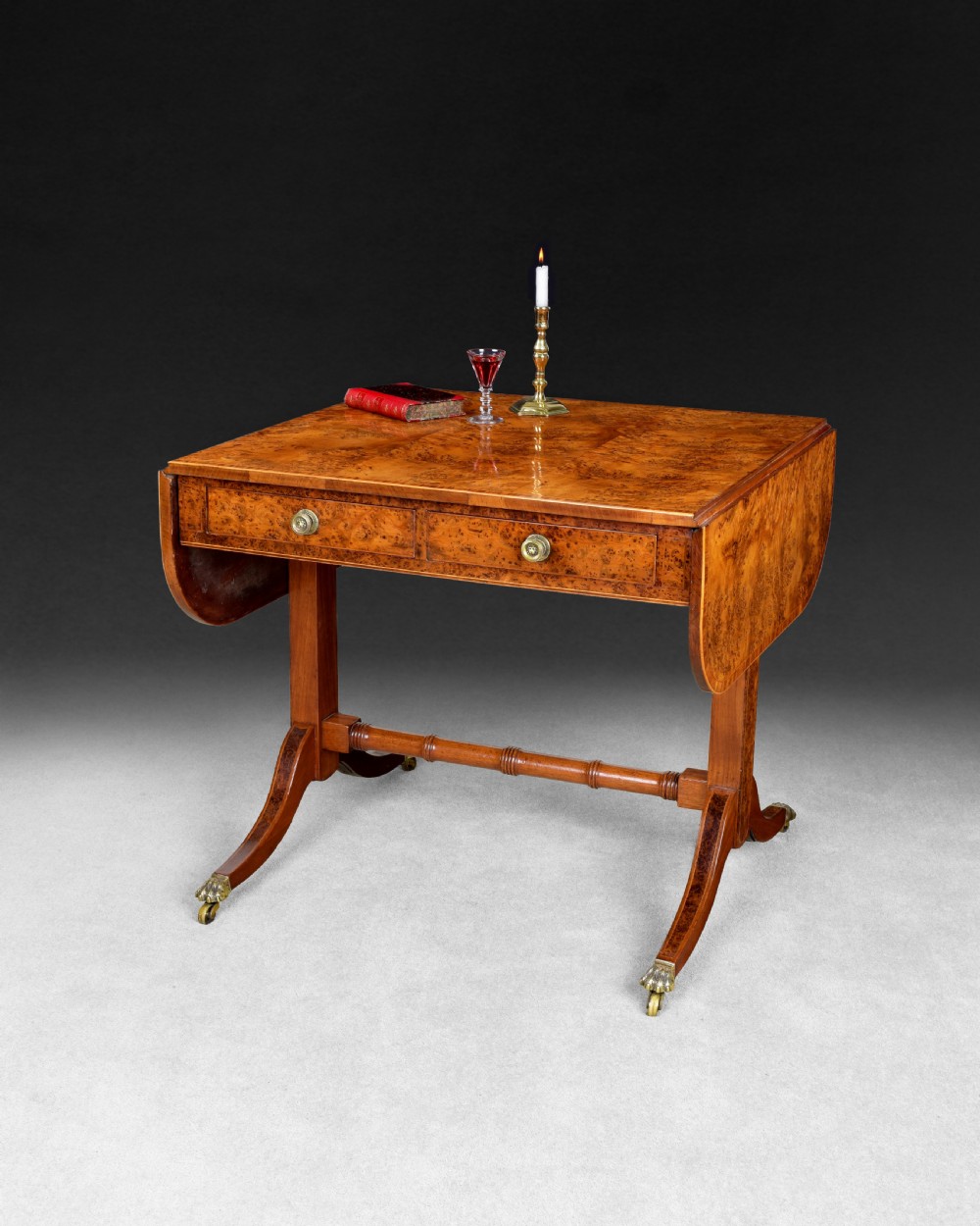 An early 19th Century Burr Yew veneered and Rosewood cross banded drop leaf Sofa Table, View II