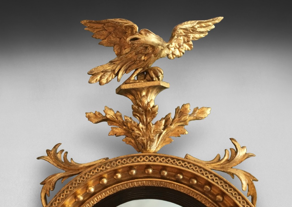 Regency Convex Gilt Mirror surmounted by an eagle  View II