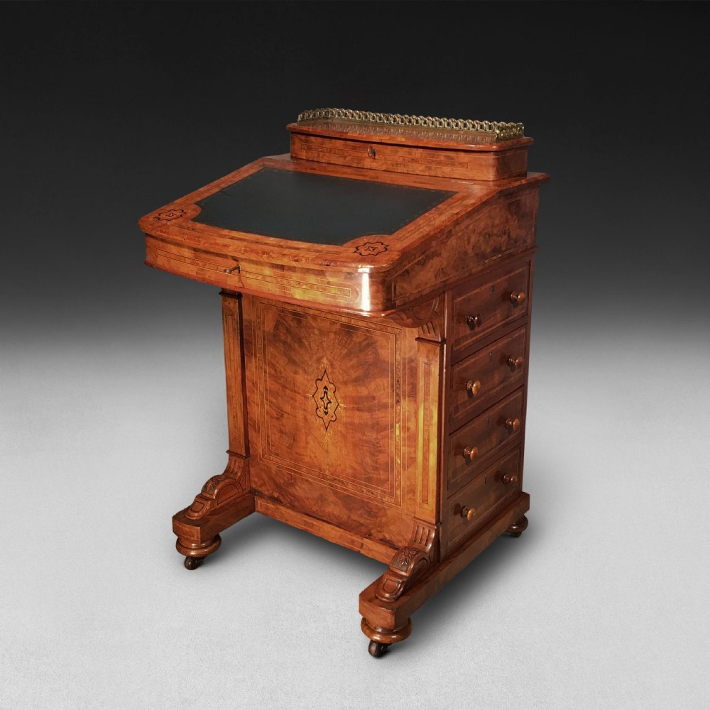 A Victorian inlaid Walnut and Crossbanded Davenport