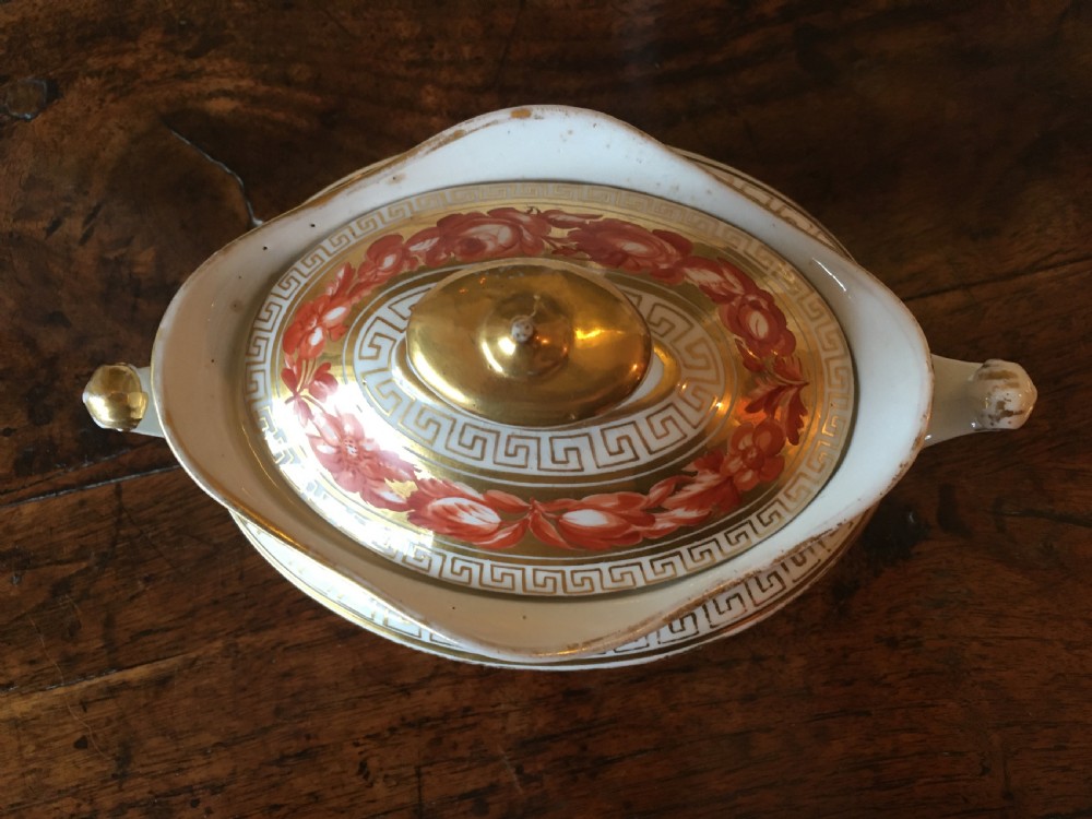 A Regency Coalport porcelain covered sucriere decorated with orange hand-painted flowers, gilded Greek key borders, and twin side handles. View II