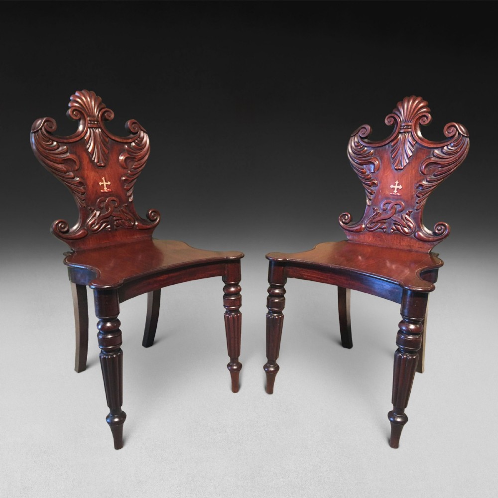 A pair of Regency mahogany hall chairs View III