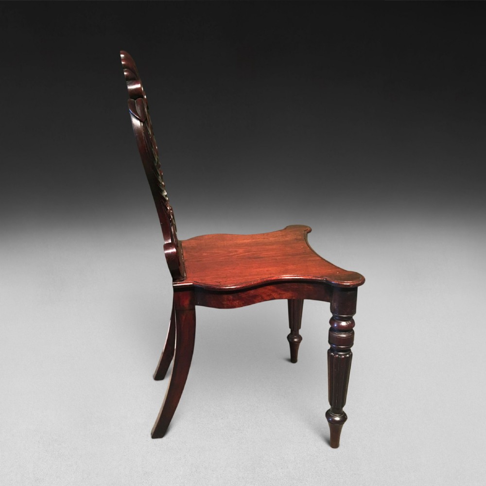 A pair of Regency mahogany hall chairs View V