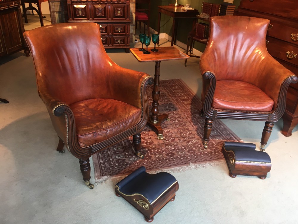 Pair of Regency Rosewood and Brass Gout Stools of scrolling form with leather upholstered foot rests View V