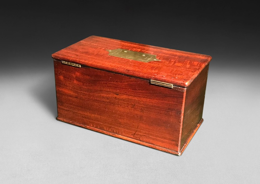 A Regency mahogany apothecary box shown open to display glass bottles, small drawers, brass fittings, and a key. View VIII