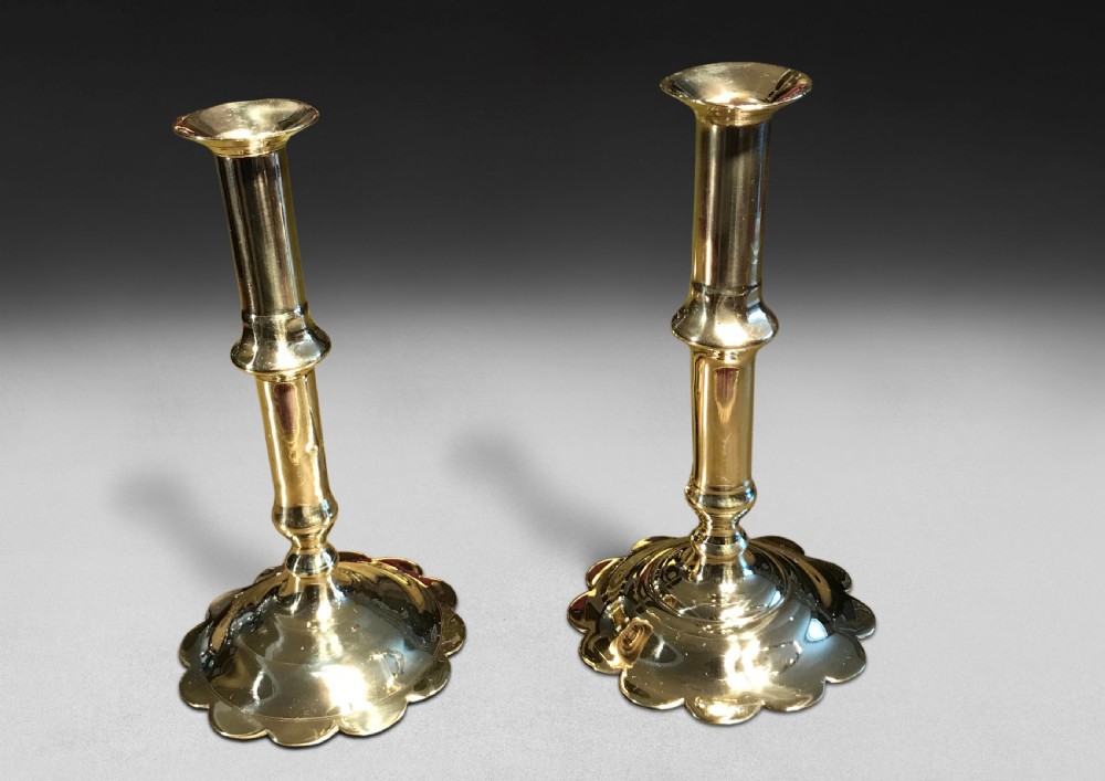Two early 18th. Century Brass Ejector Candlesticks
