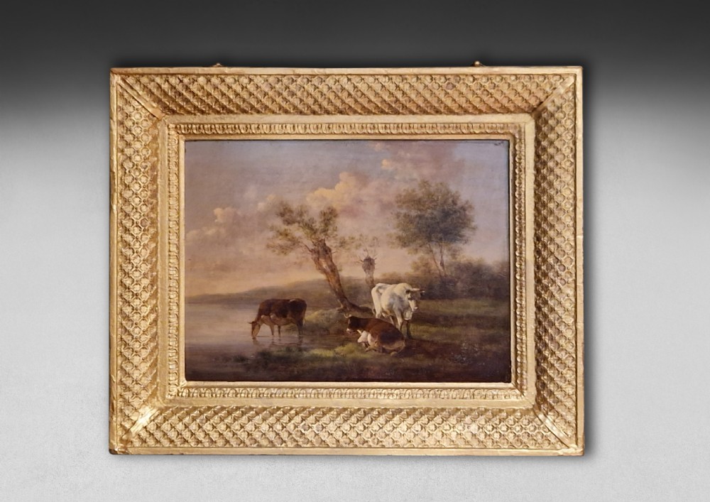 A pair of early 19th-century pastoral oil paintings depicting rural landscapes with grazing cattle, housed within matching decorative gilded frames. View III