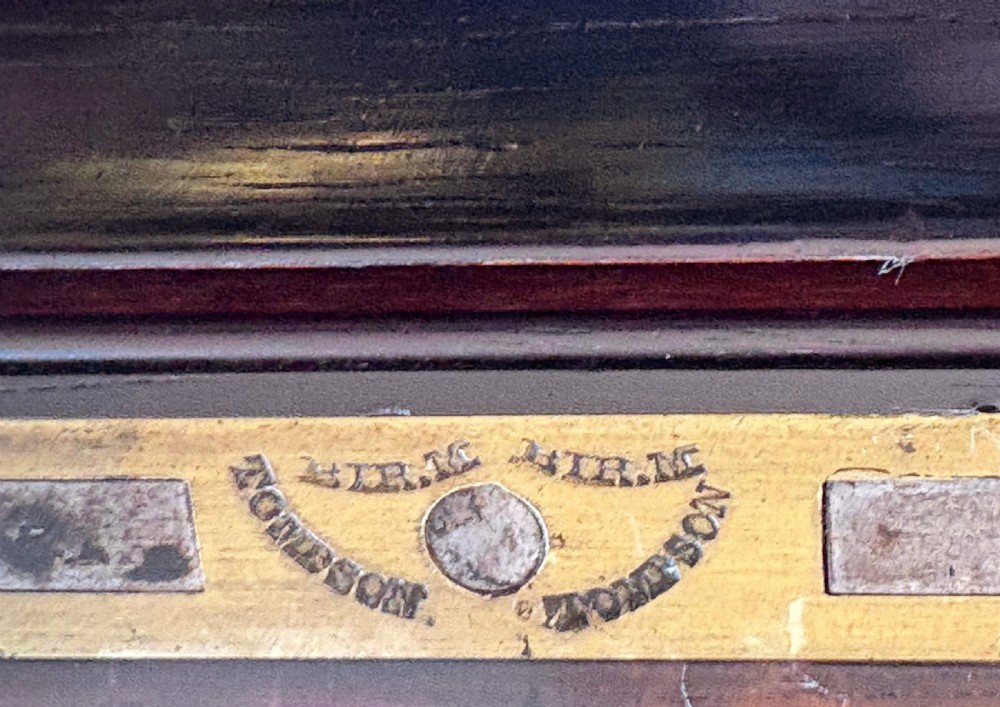 An opened Regency rosewood writing slope featuring brass inlay, brass candle sockets, side handles, and a dark leather writing surface. View VI