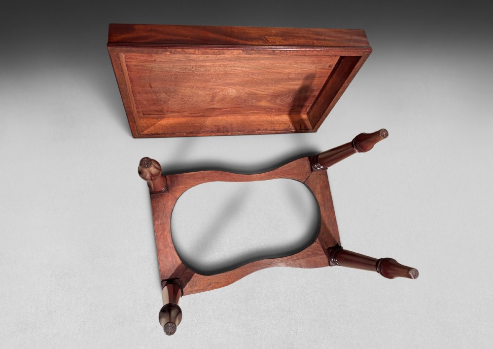 A Regency mahogany bidet table featuring a removable rectangular lid, deep reeded aprons, and turned tapered legs. View II