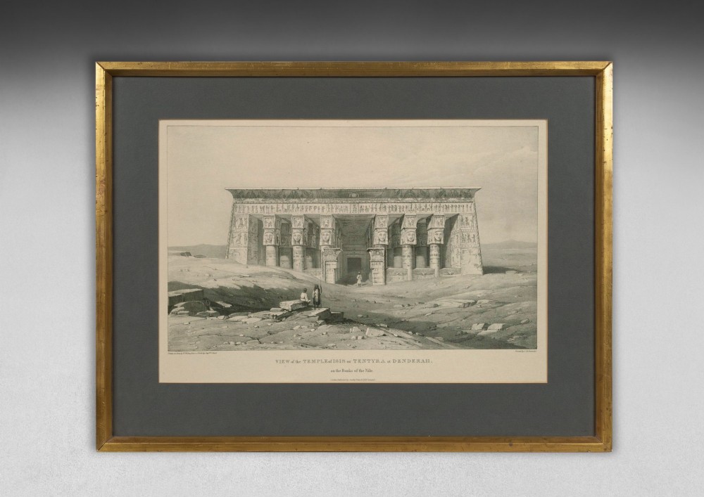 A set of eight 19th-century framed lithographs depicting ancient Egyptian temples, monuments, and landscapes, presented in gilt frames with dark grey mounts. View X