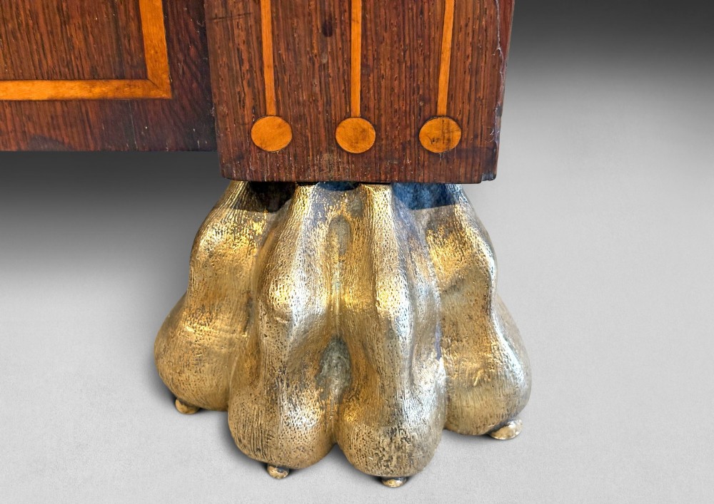 A pair of Regency rosewood chiffoniers featuring boxwood stringing, brass lattice panel doors, upper display shelves with brass galleries, and claw feet. View II