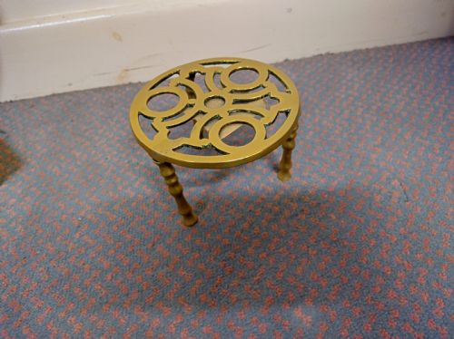 Brass trivet circa 1900.