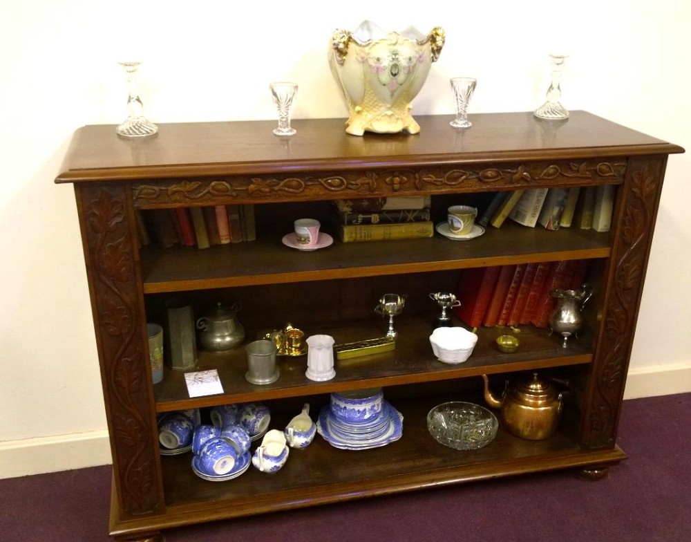 Open Fronted Walnut bookcase with adjustable shelves.