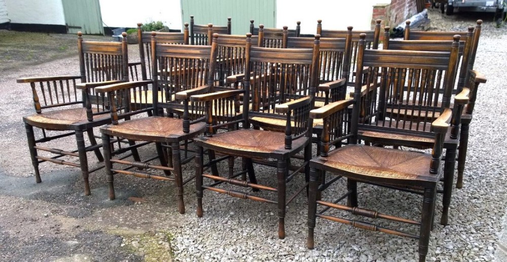 A Very rare set of 12 arm chairs in Arts and Crafts Style