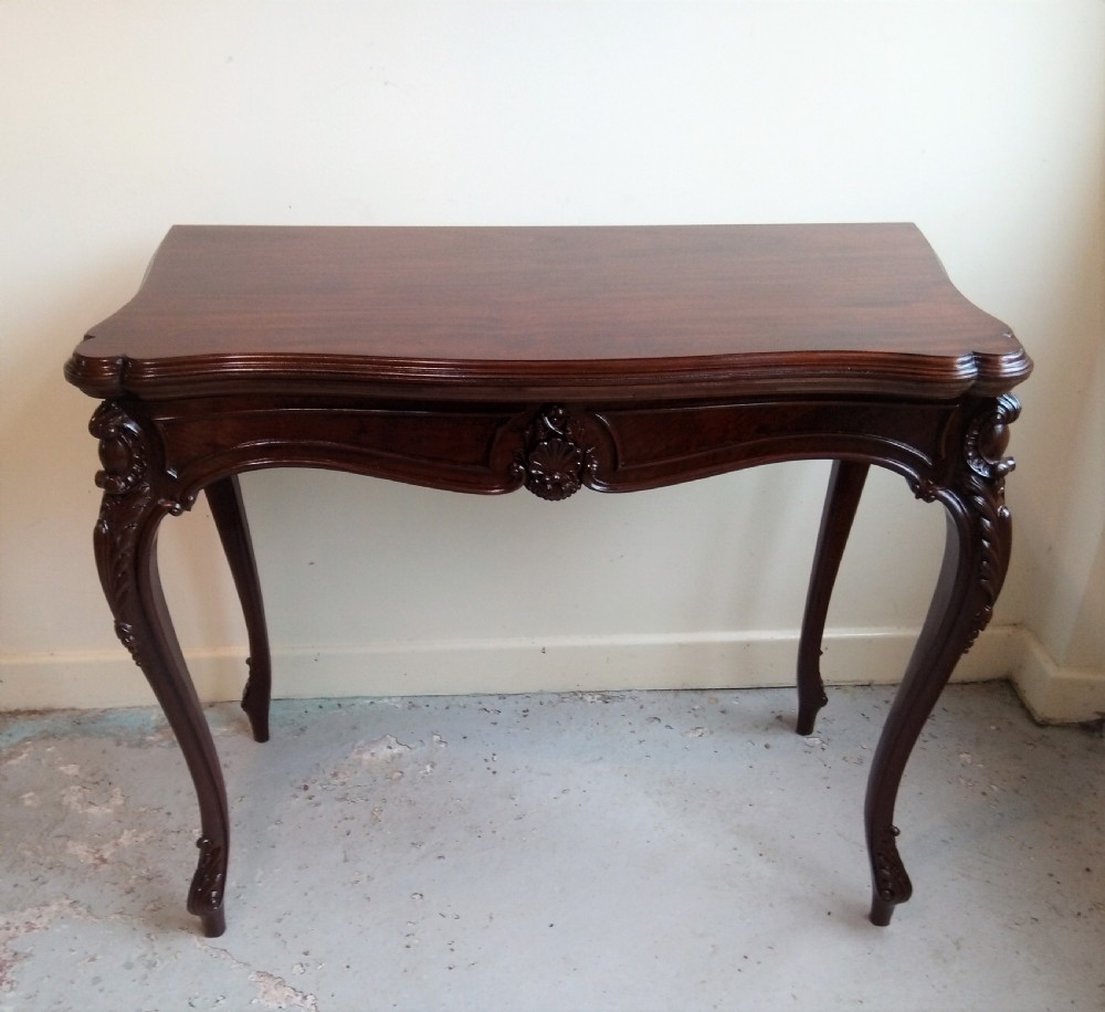 Mahogany fold over table on elegant cabriole leg