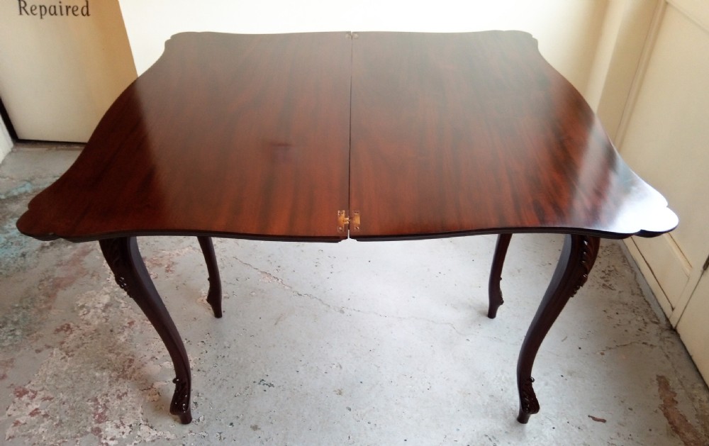Mahogany fold over table on elegant cabriole leg View VI