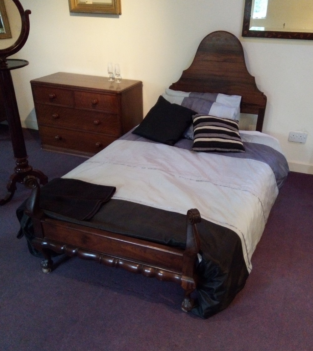 Tidy single bed in Queen Anne style with scroll base.
