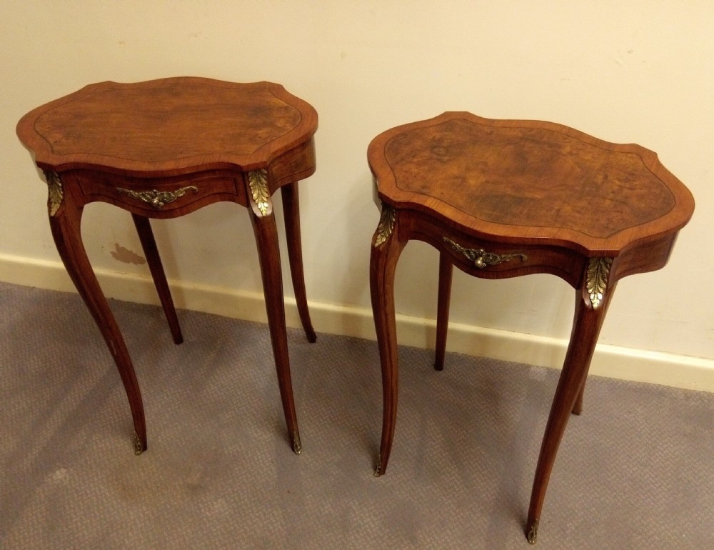 Rare pair of attractive inlaid occasional tables with Ormolu mounts.