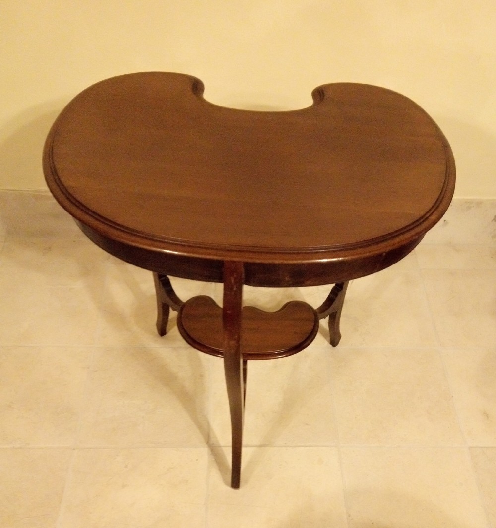 An Edwardian mahogany kidney-shaped occasional table featuring cabriole legs and a matching lower tier shelf. View III