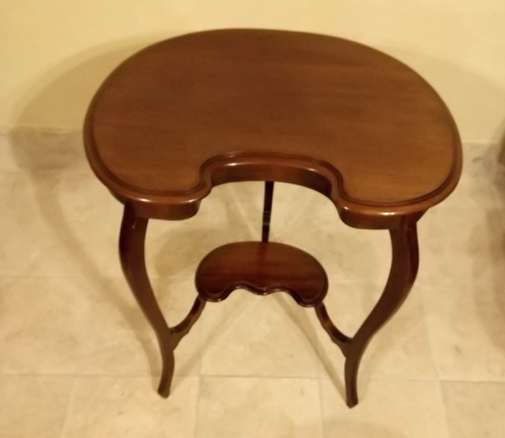 An Edwardian mahogany kidney-shaped occasional table featuring cabriole legs and a matching lower tier shelf. View V