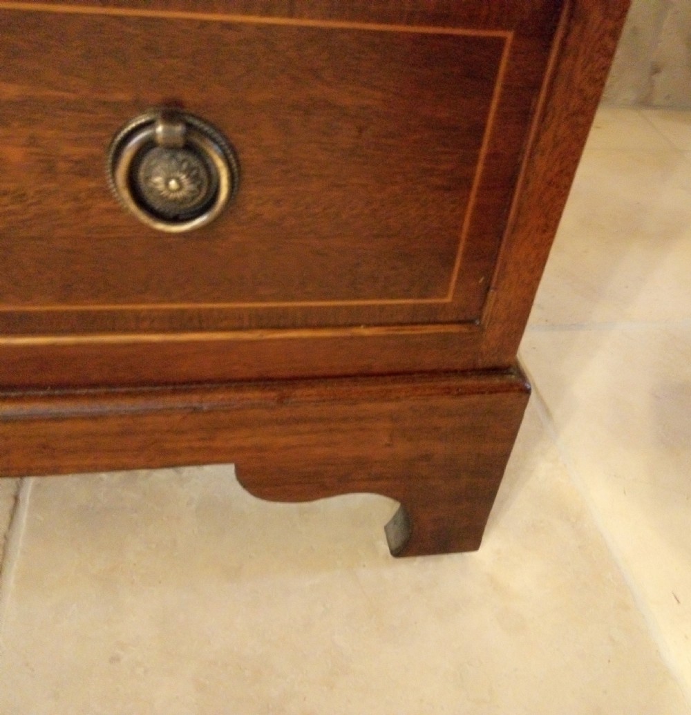 Lovely neat small chest of drawers converts to a desk. View IV