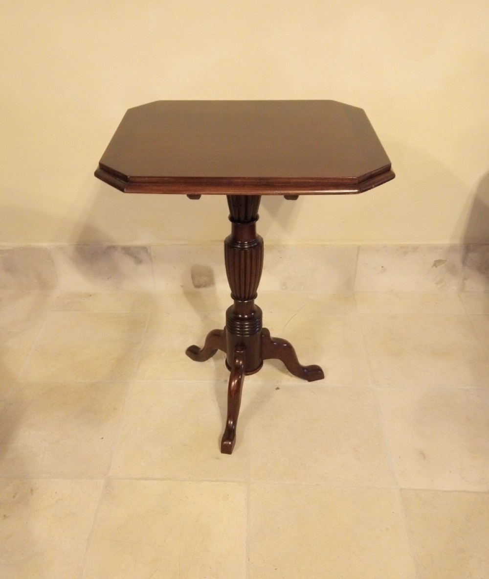 Clean and tidy snap top occasional table on pretty pedestal.
