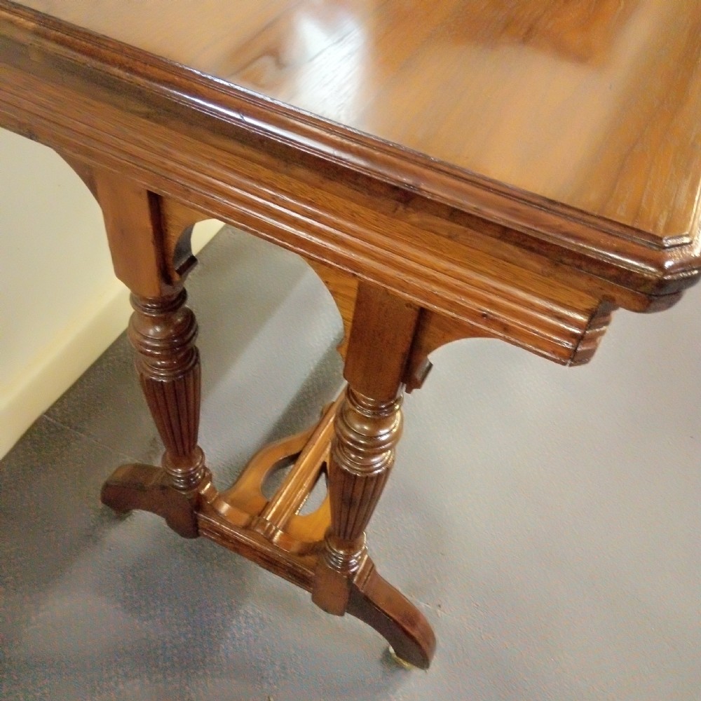 A good clean walnut stretcher table games table. View V