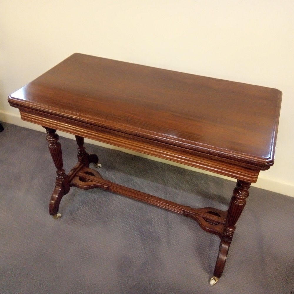 A good clean walnut stretcher table games table. View VI
