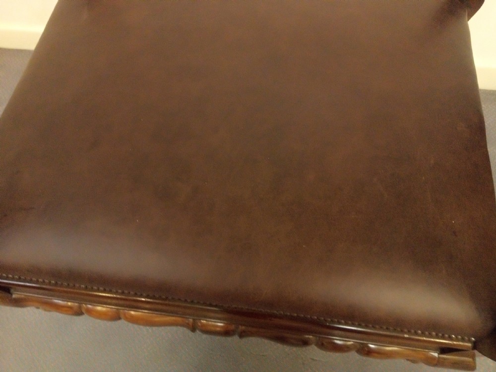 Impressive leather and mahogany stool in most unusual design.  View IV