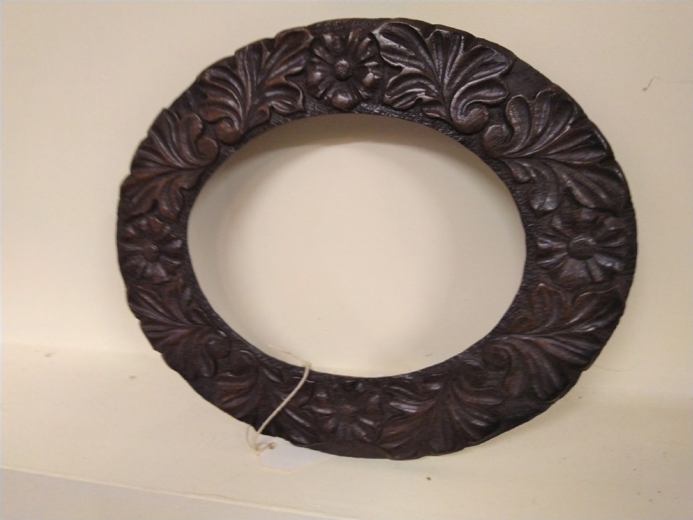 Oval carved picture or mirror frame. 