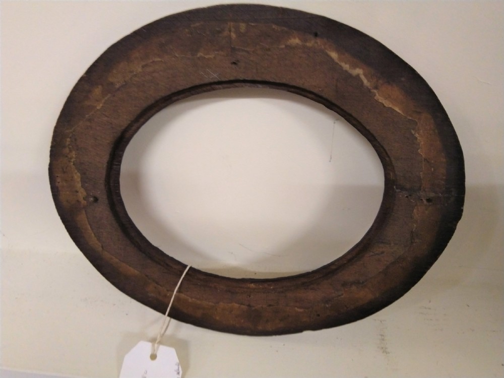 Oval carved picture or mirror frame.  View II