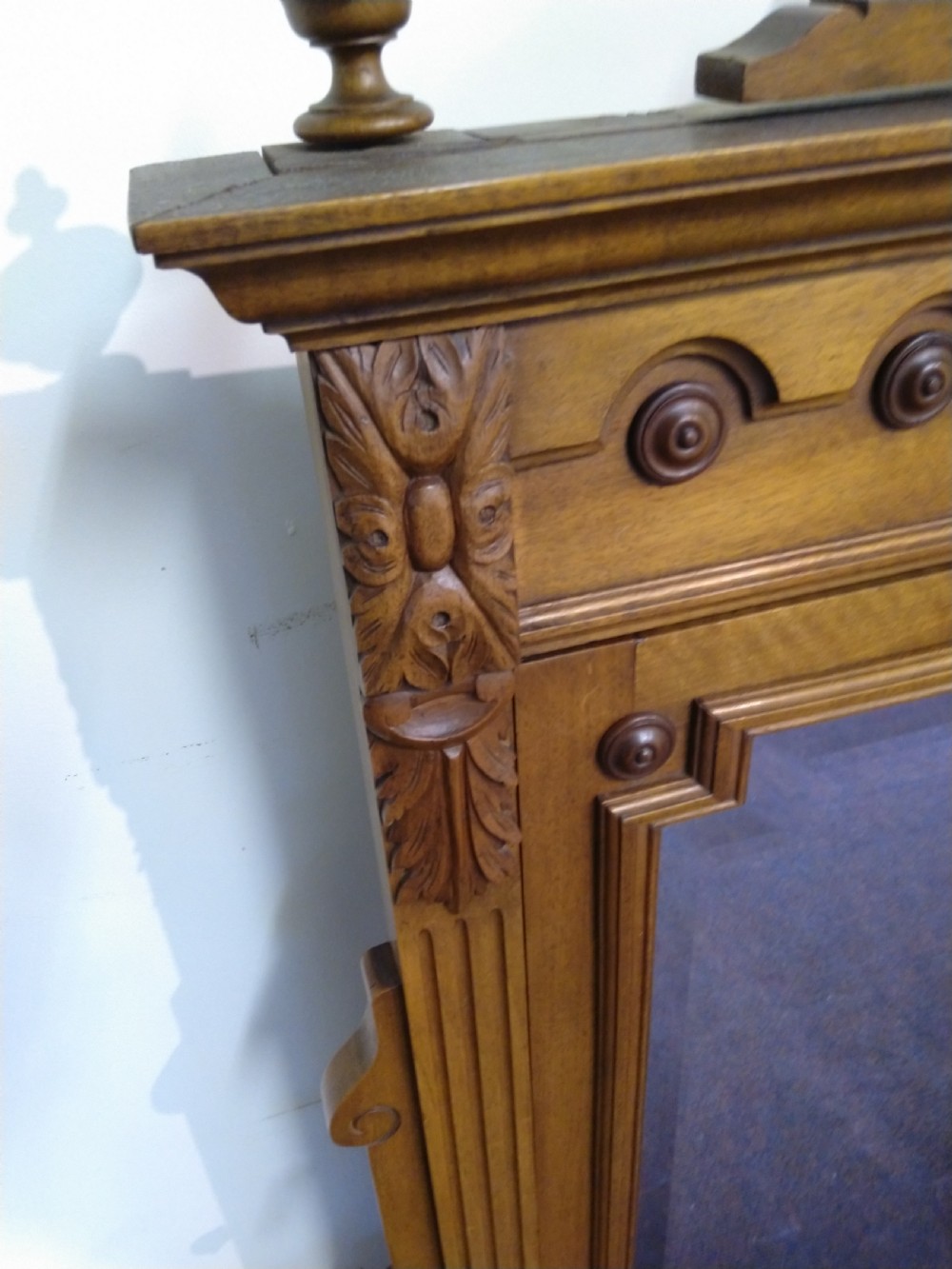 A carved French walnut dressing table mirror featuring an ornate carved pediment, fluted side columns, rectangular mirror glass, and two small trinket drawers at the base. View III