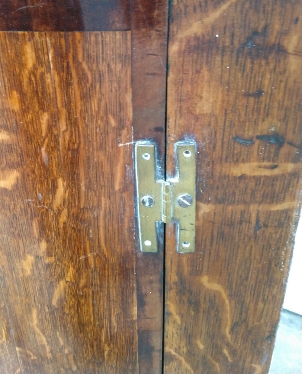 Bow front corner cabinet in Oak View III