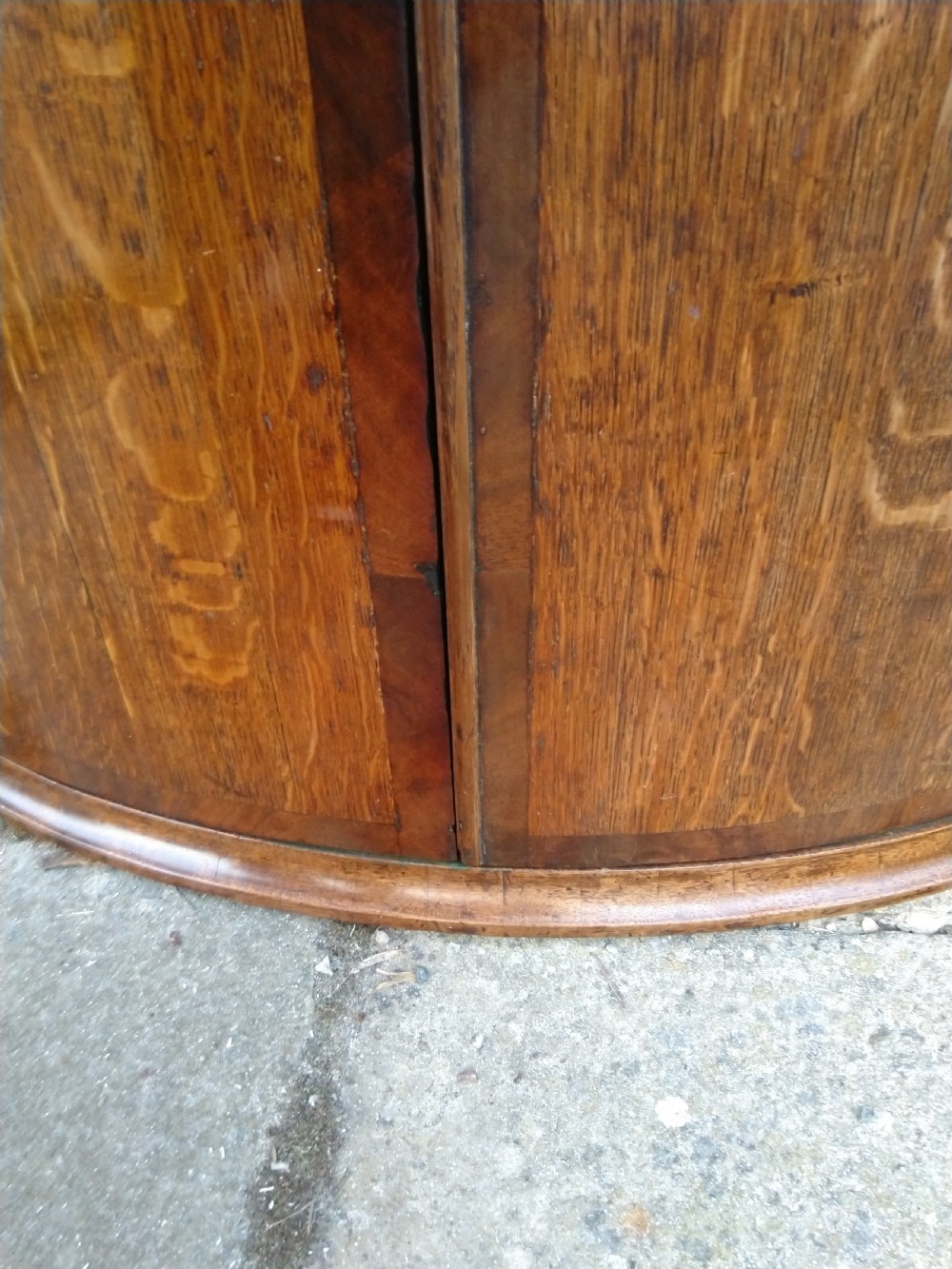 Bow front corner cabinet in Oak View V