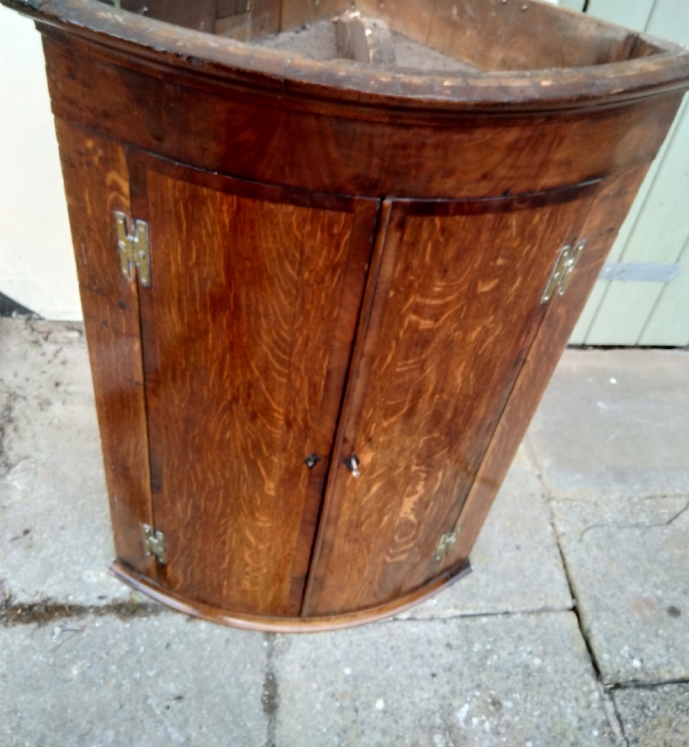 Bow front corner cabinet in Oak View VI