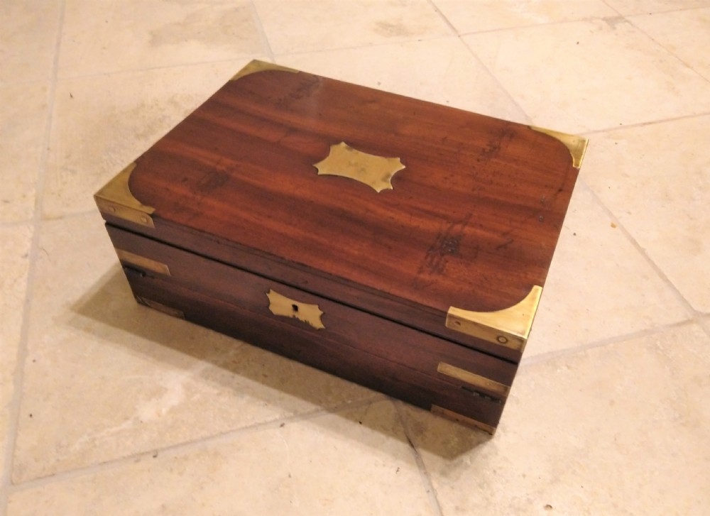 A rectangular dark mahogany wood writing slope featuring polished brass corner mounts, an escutcheon, and a brass central cartouche. View II