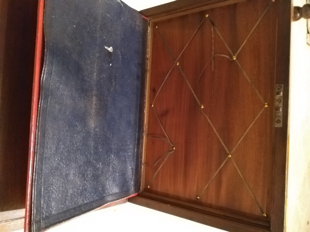 A rectangular dark mahogany wood writing slope featuring polished brass corner mounts, an escutcheon, and a brass central cartouche. View IV