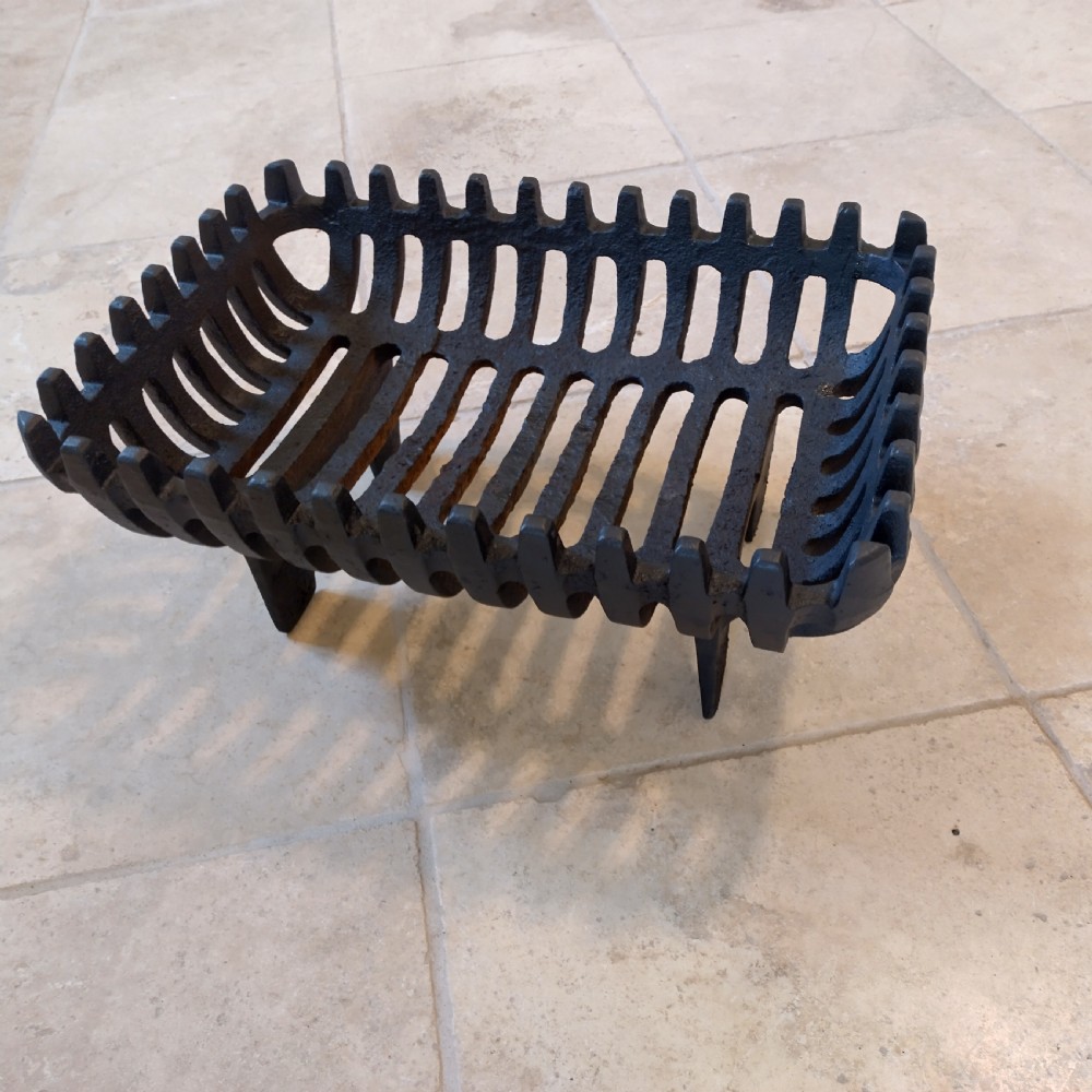 Cast fire basket shaped grate with cast fire front View II