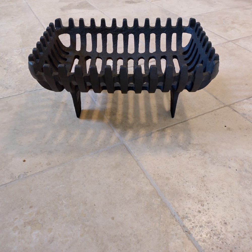 Cast fire basket shaped grate with cast fire front View III