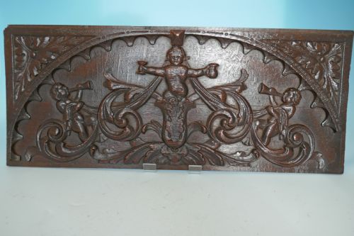 antique 17thc oak carved panel showing the green man flanked by horn blowing putti flemish c166080 - CATEGORY: ANTIQUE MISCELLANEOUS - DATED 17TH CENTURY