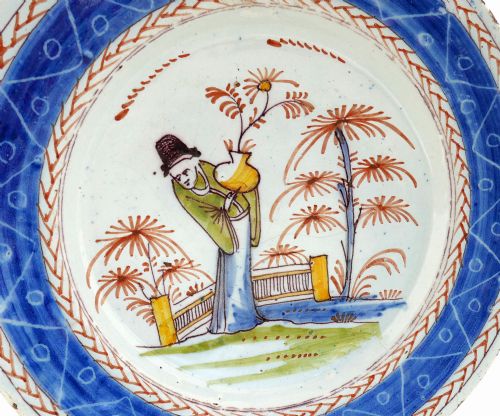 ANTIQUE EARLY POTTERY 18THC DELFT POLYCHROME PLATE WITH ORIENTAL FIGURE CARRYING FLOWERS DUTCH C178090 - ADDITIONAL PHOTO 1
