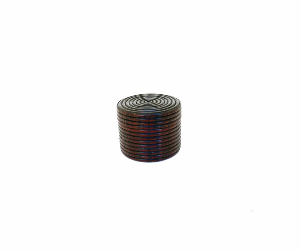 A cylindrical antique rosewood treen box featuring concentric turned rings on the lid and body.