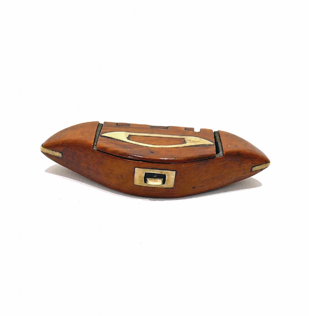 A boat-shaped fruitwood shuttle snuff box featuring decorative bone inlay on the hinged lid and front catch mechanism.