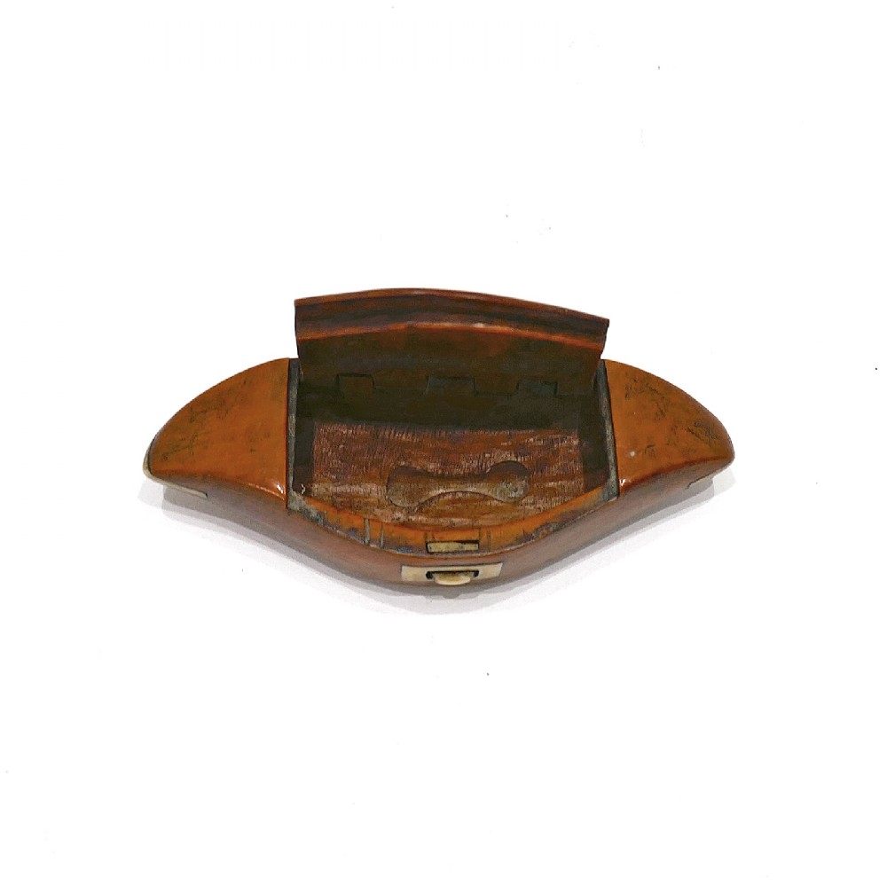 A boat-shaped fruitwood shuttle snuff box featuring decorative bone inlay on the hinged lid and front catch mechanism. View III