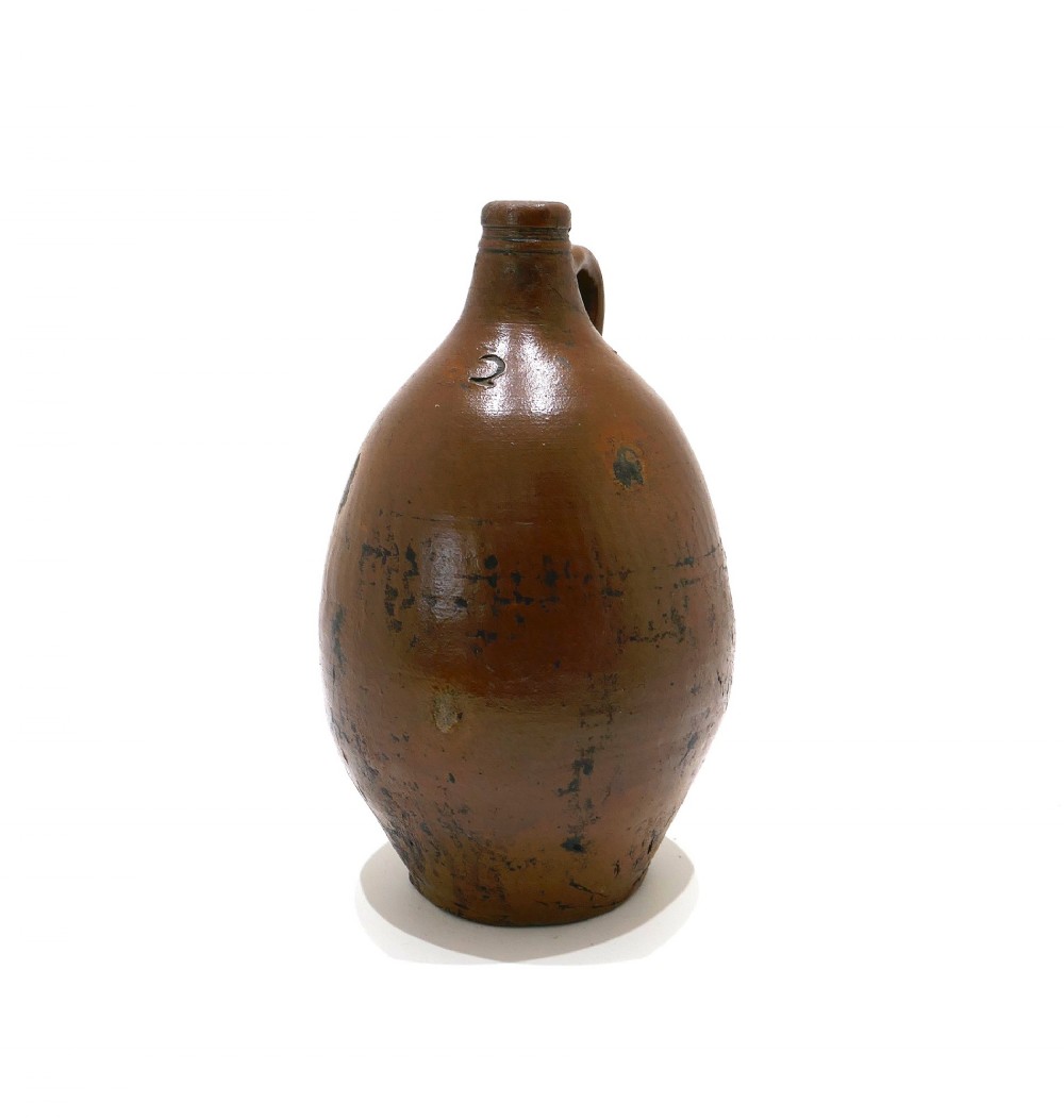 An 18th-century salt-glazed brown stoneware flagon featuring a bulbous body, narrow neck, loop handle, and an impressed number two on the shoulder.